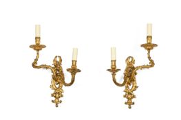 A PAIR OF RÉGENCE GILT BRONZE TWIN BRANCH WALL LIGHTS, FRENCH, CIRCA 1720