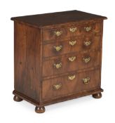 A GEORGE I WALNUT AND CROSSBANDED CHEST OF DRAWERS, CIRCA 1725