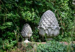 A PAIR OF COMPOSITION STONE PINEAPPLE FINIALS, BY AUSTIN AND SEELEY, CIRCA 1860-1880