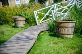 A PAIR OF TEAK, BRASS AND BRONZE MOUNTED GARDEN PLANTERS, IN REGENCY STYLE, CONTEMPORARY