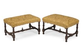 A PAIR OF WILLIAM III WALNUT AND SILK DAMASK UPHOLSTERED STOOLS, CIRCA 1700