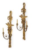 A PAIR OF CARVED GILTWOOD AND GESSO EAGLE MOUNTED TWO BRANCH WALL LIGHTS OR SCONCES