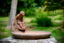 A COMPTON POTTERY TERRACOTTA CHERUB BIRDBATH, EARLY 20TH CENTURY