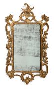 A CARVED GILTWOOD MIRROR, IN GEORGE III STYLE, 19TH CENTURY