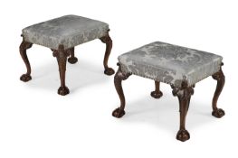 A PAIR OF GEORGE II 'RED WALNUT' STOOLS, CIRCA 1755