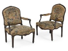 A PAIR OF LOUIS XVI EBONISED AND PARCEL GILT FAUTEUILS, LATE 18TH CENTURY