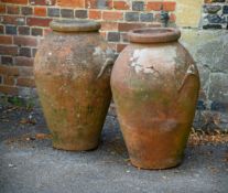 A PAIR OF ITALIAN TERRACOTTA OIL JARS, BY CARLO BITOSSI MONTELUPO, EARLY 20TH CENTURY