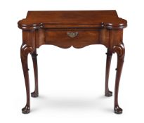 A GEORGE II MAHOGANY AND FIDDLEBACK MAHOGANY FOLDING TEA TABLE, CIRCA 1745