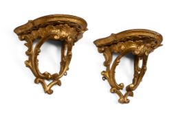 A PAIR OF GEORGE III CARVED GILTWOOD AND GESSO ROCOCO WALL BRACKETS, CIRCA 1770