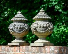 A PAIR OF COMPOSITION STONE FRUIT FINIAL VASES, BY AUSTIN AND SEELEY, CIRCA 1860-1880