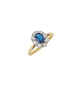 A SAPPHIRE AND DIAMOND CLUSTER RING