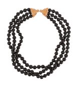 ORLANDA OLSEN, AN ONYX BEAD PART NECKLACE