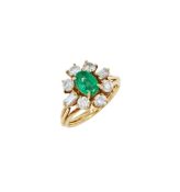 AN EMERALD AND DIAMOND CLUSTER RING