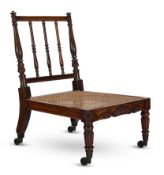 Y A REGENCY BRAZILIAN ROSEWOOD AND CANED LOW CHAIR, CIRCA 1820