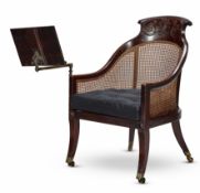 A REGENCY MAHOGANY AND CANED LIBRARY BERGÈRE, CIRCA 1820