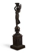 A REGENCY/EMPIRE BRONZE CANDLESTICK À LA VICTOIRE, EARLY 19TH CENTURY, IN THE MANNER OF THOMIRE DUTE