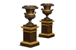 A VERY SMALL PAIR OF EMPIRE GILT AND PATINATED BRONZE URNS, EARLY 19TH CENTURY