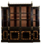 Y A REGENCY GILT-BRASS MOUNTED AND INLAID EBONY AND CALAMANDER BREAKFRONT BOOKCASE