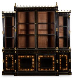 Y A REGENCY GILT-BRASS MOUNTED AND INLAID EBONY AND CALAMANDER BREAKFRONT BOOKCASE