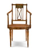 A GEORGE III POLYCHROME PAINTED SATINWOOD ARMCHAIR, CIRCA 1800, IN THE MANNER OF THOMAS SHERATON