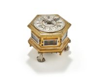 A POLISH GILT AND SILVERED BRASS HORIZONTAL HEXAGONAL TABLE CLOCK