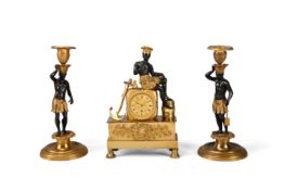 A RARE FRENCH EMPIRE GILT BRONZE MINIATURE MANTEL TIMEPIECE EMBLEMATIC OF THE TOBACCO TRADE