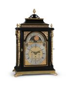 AN IMPRESSIVE GEORGE III EBONISED TWELVE-TUNE MUSICAL TABLE CLOCK WITH CALENDAR AND MOONPHASE