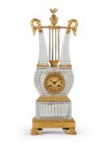 A FINE FRENCH RESTAURATION ORMOLU AND CUT VONECHE CRYSTAL LYRE-SHAPED MANTEL CLOCK