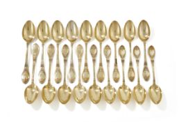 A SET OF EIGHTEEN FRENCH SILVER GILT TEA SPOONS, LAPPARRA & GABRIEL, PARIS CIRCA 1910