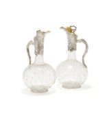 A PAIR OF VICTORIAN SILVER MOUNTED AND GLASS CLARET JUGS, GEORGE FOX, LONDON 1866