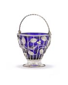 A GEORGE III SILVER SWING HANDLED WIREWORK BASKET, MAKER'S MARK DB, LONDON 1771