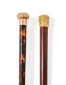 Y TWO GOLD MOUNTED WALKING STICKS