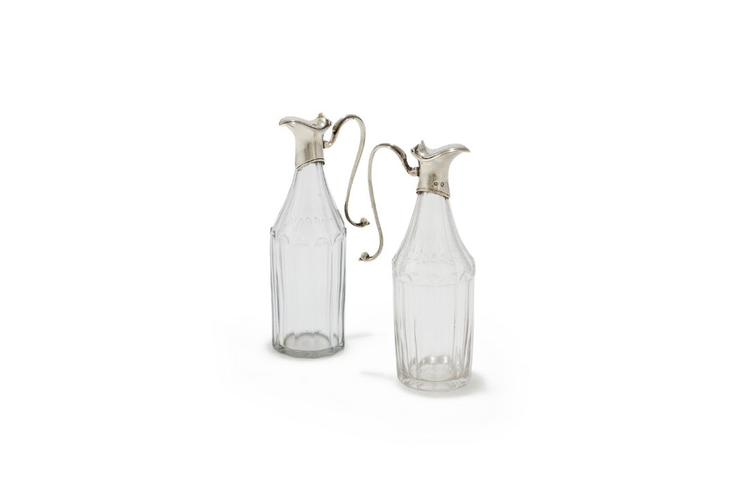 A PAIR OF SILVER MOUNTED AND FACETTED GLASS OIL BOTTLES, ROBERT HENNELL, CIRCA 1790 - Image 1 of 2