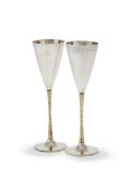 STUART DEVLIN, A PAIR OF SILVER AND SILVER GILT CHAMPAGNE FLUTES, LONDON 1978 AND 1980