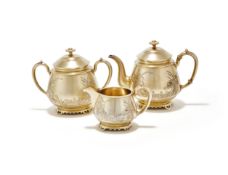 Y A RUSSIAN SILVER GILT THREE PIECE TEA SET, CARL FEBERGÉ, MOSCOW 1893
