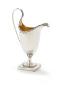 A GEORGE III SILVER HELMET SHAPED CREAM JUG, HESTER BATEMAN, LONDON 1786