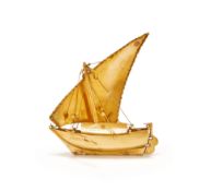 A GOLD COLOURED MODEL OF A DHOW, UNMARKED