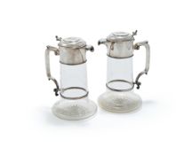 A CASED PAIR OF VICTORIAN SILVER MOUNTED AND GLASS CLARET JUGS, JAMES DIXON & SONS, SHEFFIELD 1885