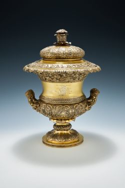 AN INDIAN COLONIAL SILVER GILT TWIN HANDLED TROPHY CUP AND COVER, HAMILTON & CO., CIRCA 1830