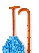 Y A CASED PRESSED TORTOISESHELL WALKING STICK AND A PARASOL