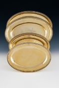 A SET OF THREE FRENCH EMPIRE SILVER GILT OVAL SERVING DISHES, SIGNED 'BIENNAIS' IN SCRIPT, PARIS MAR