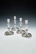 A SET OF FOUR GEORGE I CAST SILVER CANDLESTICKS, SAMUEL MARGAS, LONDON 1724