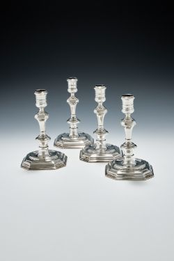 A SET OF FOUR GEORGE I CAST SILVER CANDLESTICKS, SAMUEL MARGAS, LONDON 1724