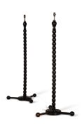 Y A PAIR OF EBONY STANDARD LAMPS, INDIAN, MODERN