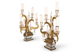 Ω ATTRIBUTED TO MAISON BAGUES: A PAIR OF FOUR BRANCH GLASS, GILT METAL AND ROCK CRYSTAL TABLE LIGHTS