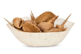 A LARGE MARBLE MORTAR FILLED WITH CARVED WOODEN SHELLS, MODERN
