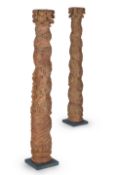 A PAIR OF RED PAINTED CARVED HARDWOOD ARCHITECTURAL COLUMNS, 17TH/18TH CENTURY