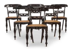 Y A SET OF SIX CEYLONESE CARVED EBONY AND CANED CHAIRS, SECOND HALF 19TH CENTURY