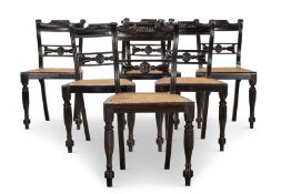 Y‡ A SET OF SIX EBONY AND CANED DINING CHAIRS, INDIAN, SECOND HALF 19TH CENTURY, OF REGENCY STYLE