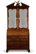 A GEORGE II PARCEL GILT DECORATED MAHOGANY BUREAU CABINET, MID 18TH CENTURY